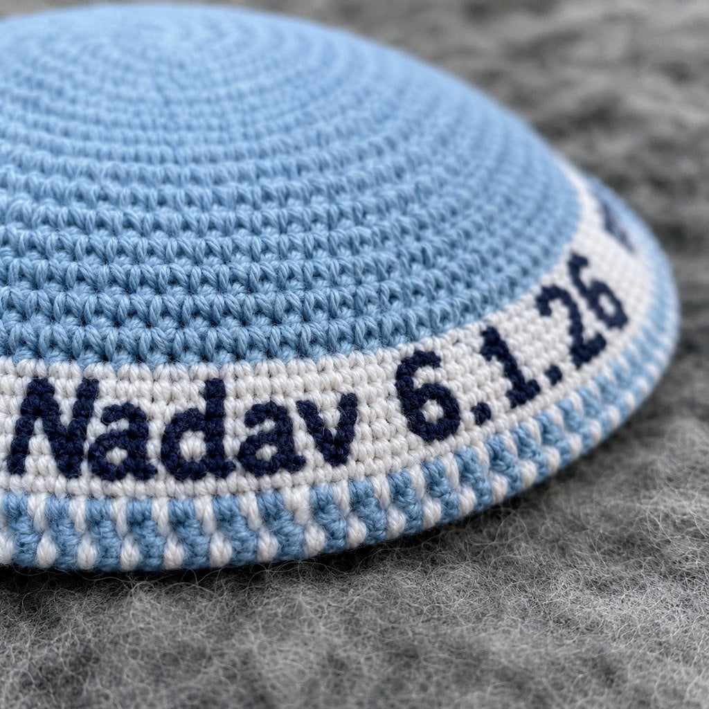 Custom knit and crochet kippah with a personalized name in the border